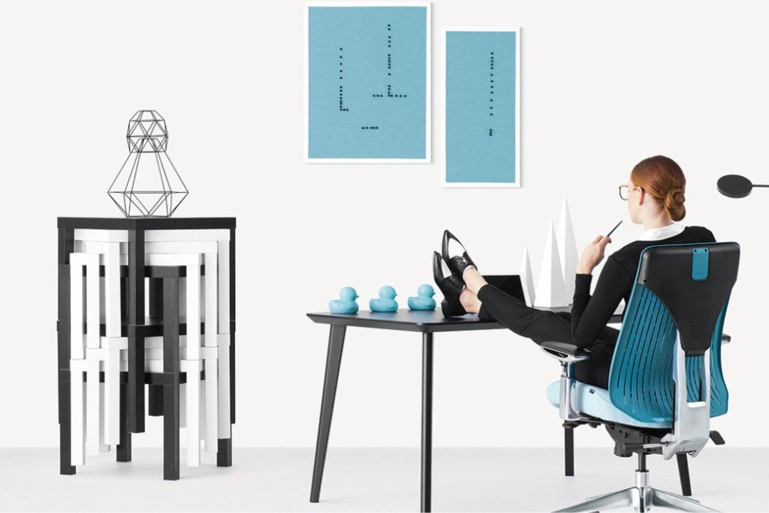 a girl sitting on an office master truly series chair